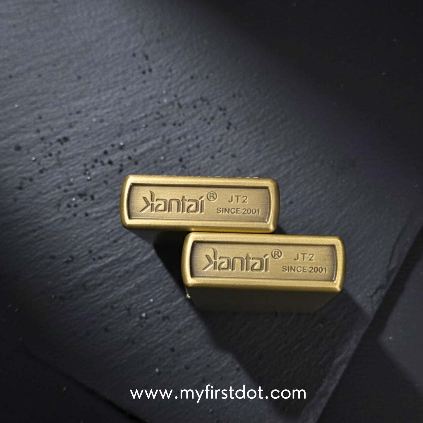 Two gold bars with 'Kantai' branding on a dark textured surface.