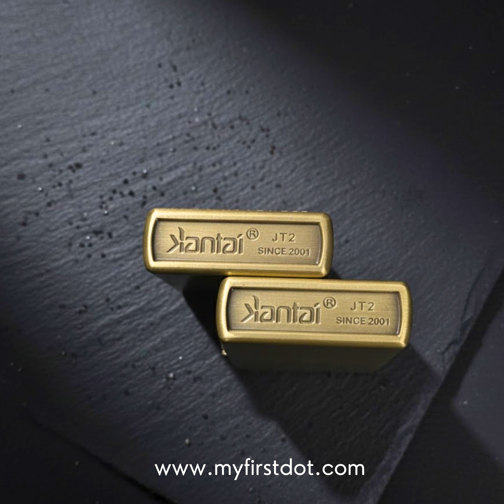 Two gold bars with 'Kantai' branding on a dark textured surface.