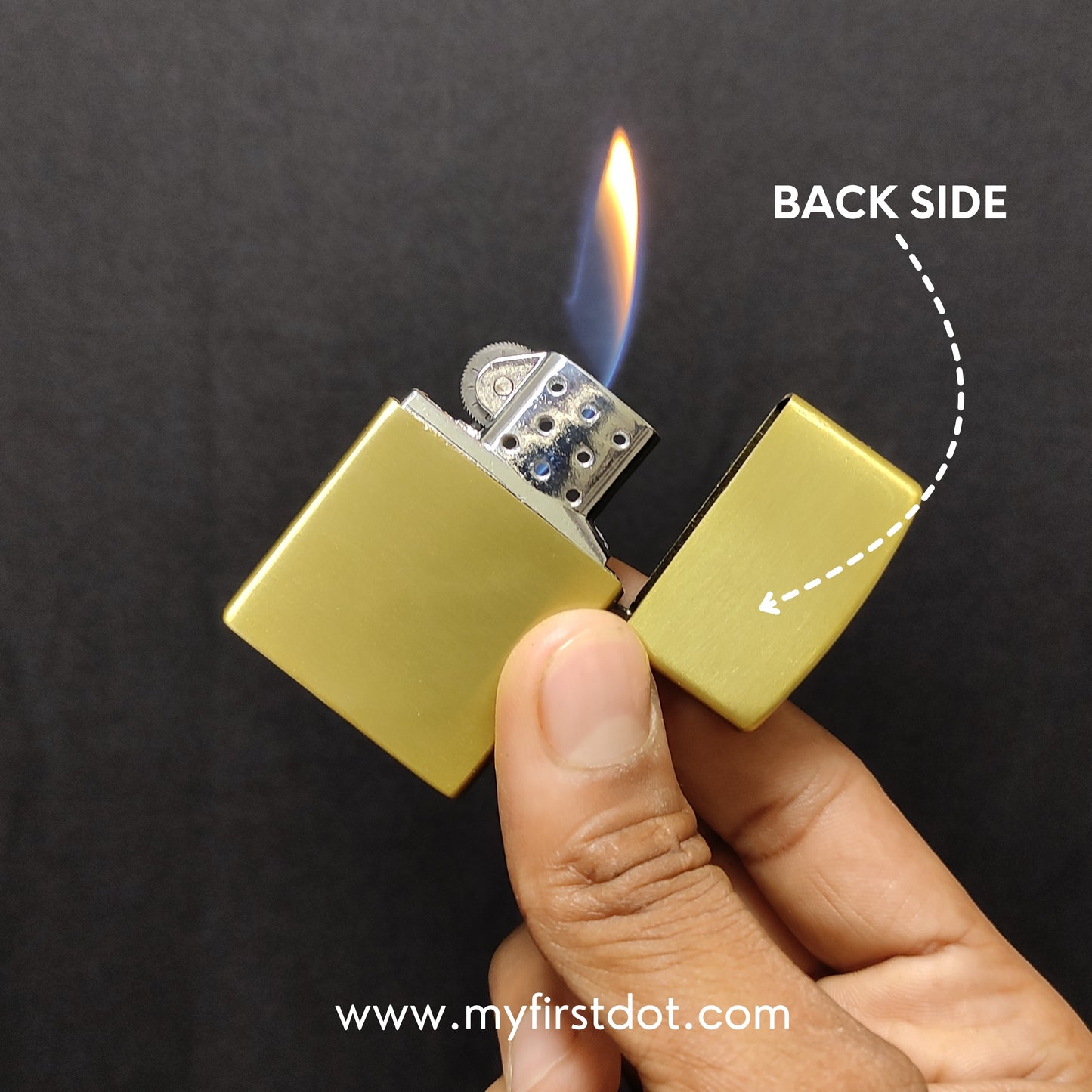 Gold lighter being held with a flame, labeled 'Back Side', on a dark background.