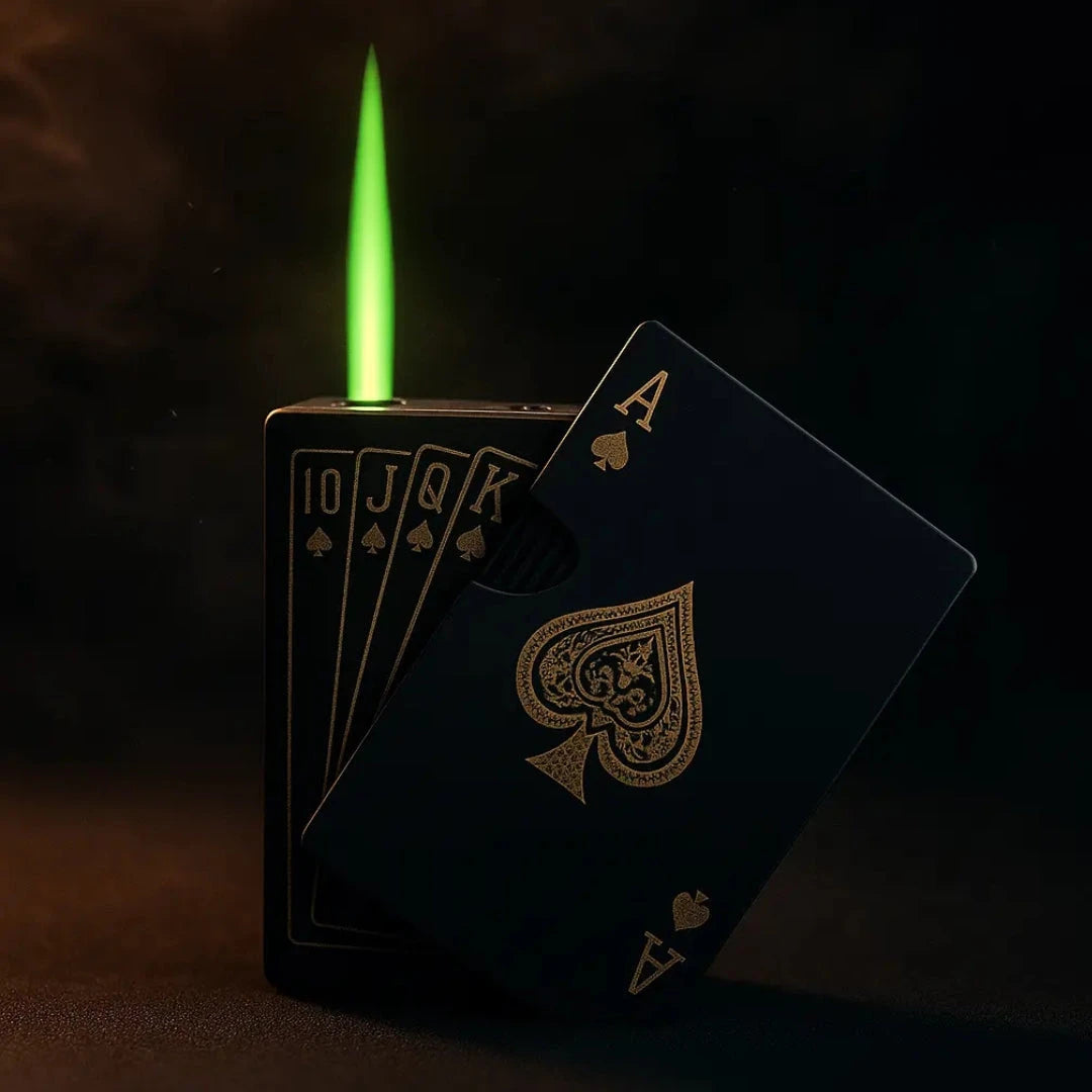 A luxury matte black card-shaped lighter with gold spade designs and a vivid green flame, set against a dark textured background with soft spotlight, moody shadows, and subtle smoke effects.