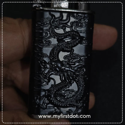 Black lighter with dragon design held in hand, brand 'myfirstdot' visible