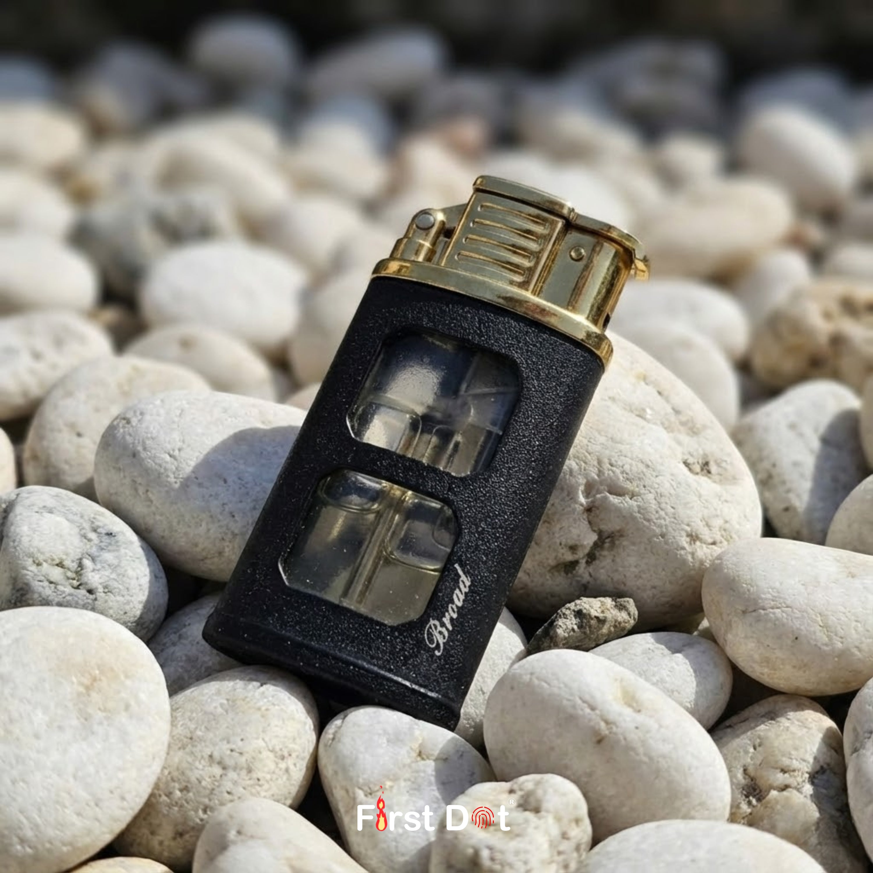 A jet flame lighter with gold metal construction and dual tank windows. IgniteView delivers reliability, style, and simple fuel monitoring.