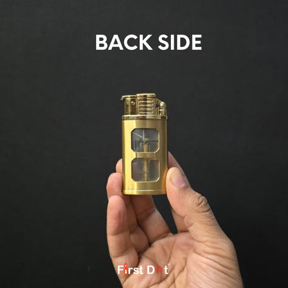 Gold lighter held in a hand with 'Back Side' text on a black background