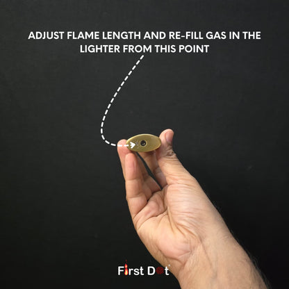 Hand holding a lighter with text on adjusting flame length and refilling gas, against a black background.