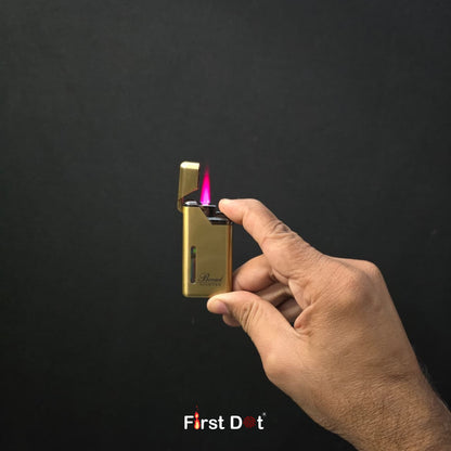 Hand holding a gold lighter with a visible flame against a black background, featuring the 'First Dot' brand.
