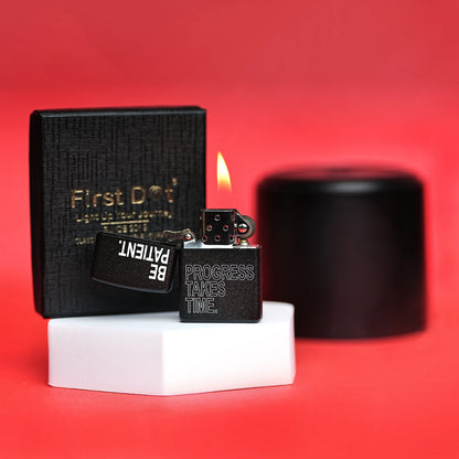 Black lighter with 'First Dot' packaging on a red background Be Patient Premium Refillable Cigarette Lighter