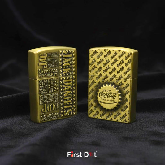 Two gold lighters, one with Jack Daniel's branding and the other with Coca-Cola branding, on a black background.