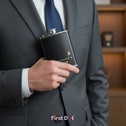 Person in a suit holding a Johnnie Walker black flask with 'First Dot' branding.