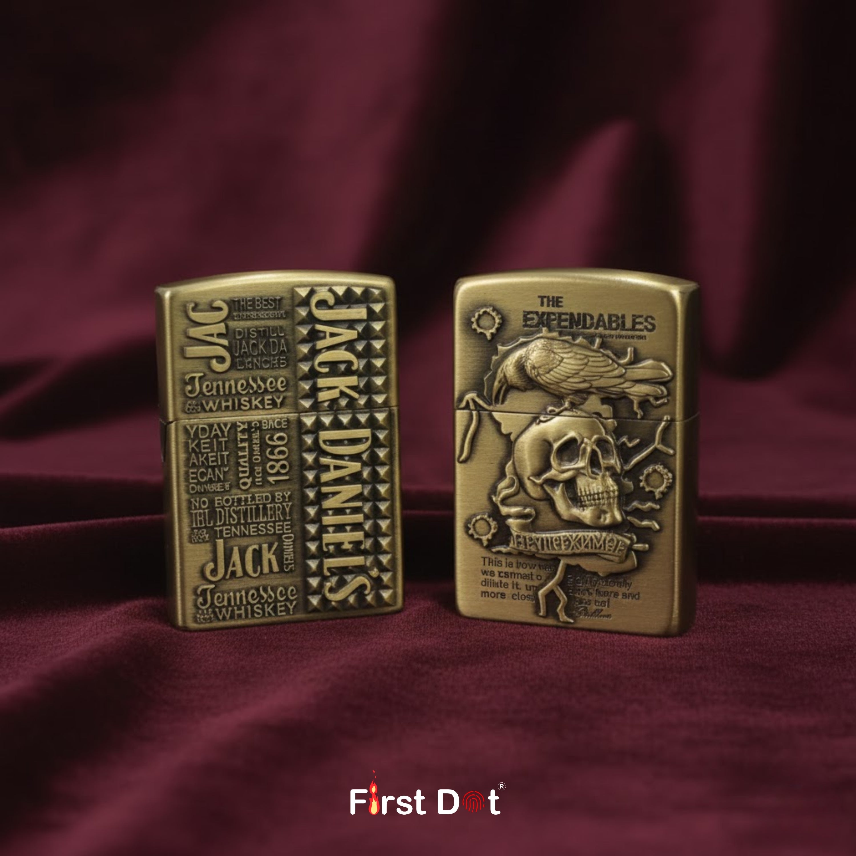 Two bronze lighters, one with Jack Daniel's branding and the other with 'The Expendables' design, on a red fabric background.