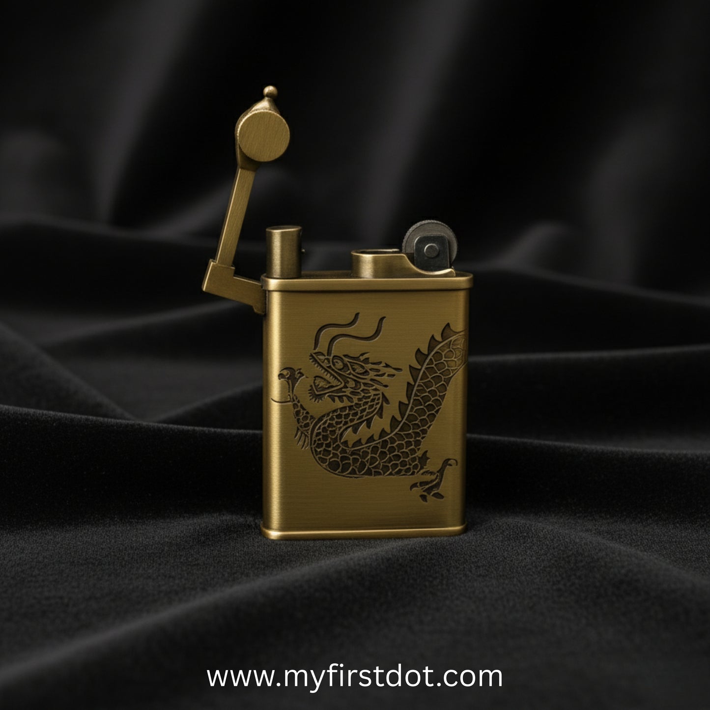 Gold lighter with dragon design on a black fabric background