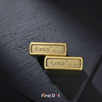 Two gold Kantai JT2 branded objects on a dark textured surface with 'First Dot' branding.