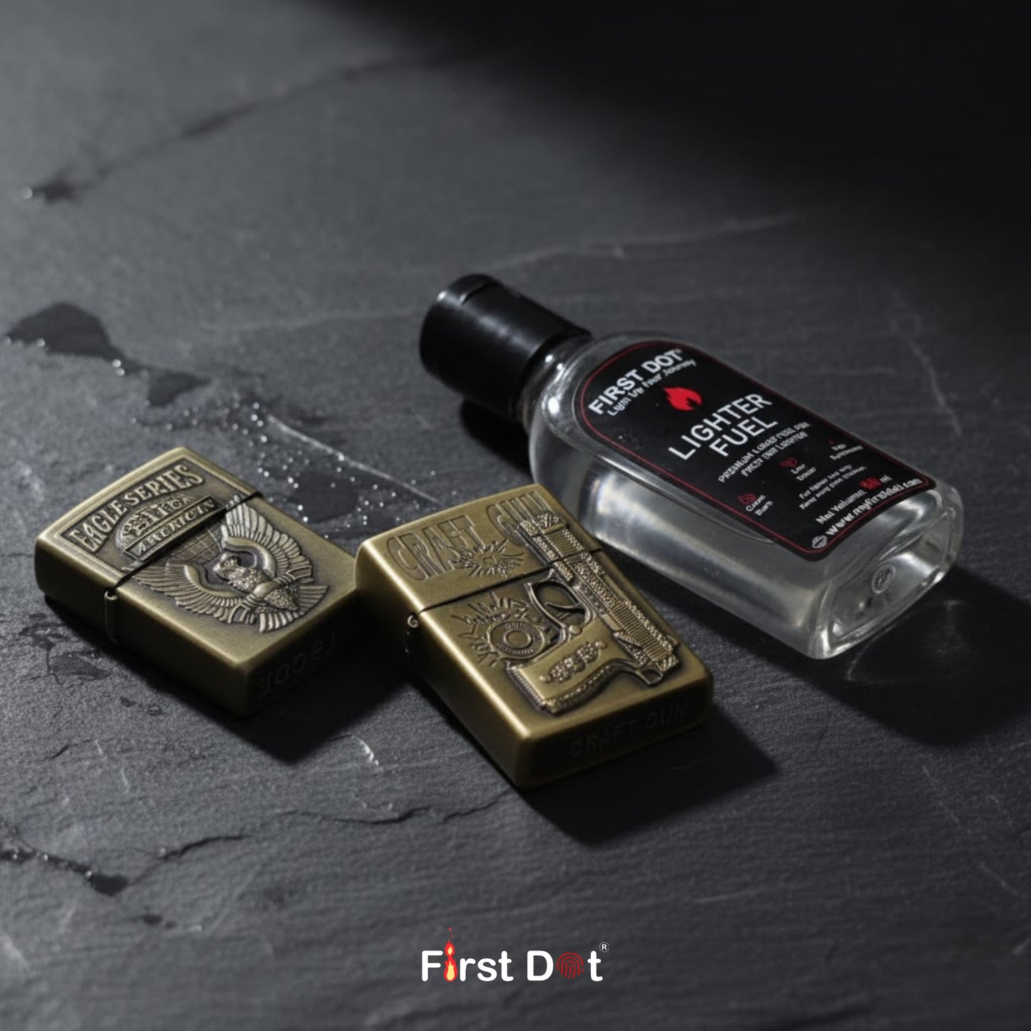 Two brass lighters and a bottle of lighter fuel on a dark surface with 'First Dot' branding.