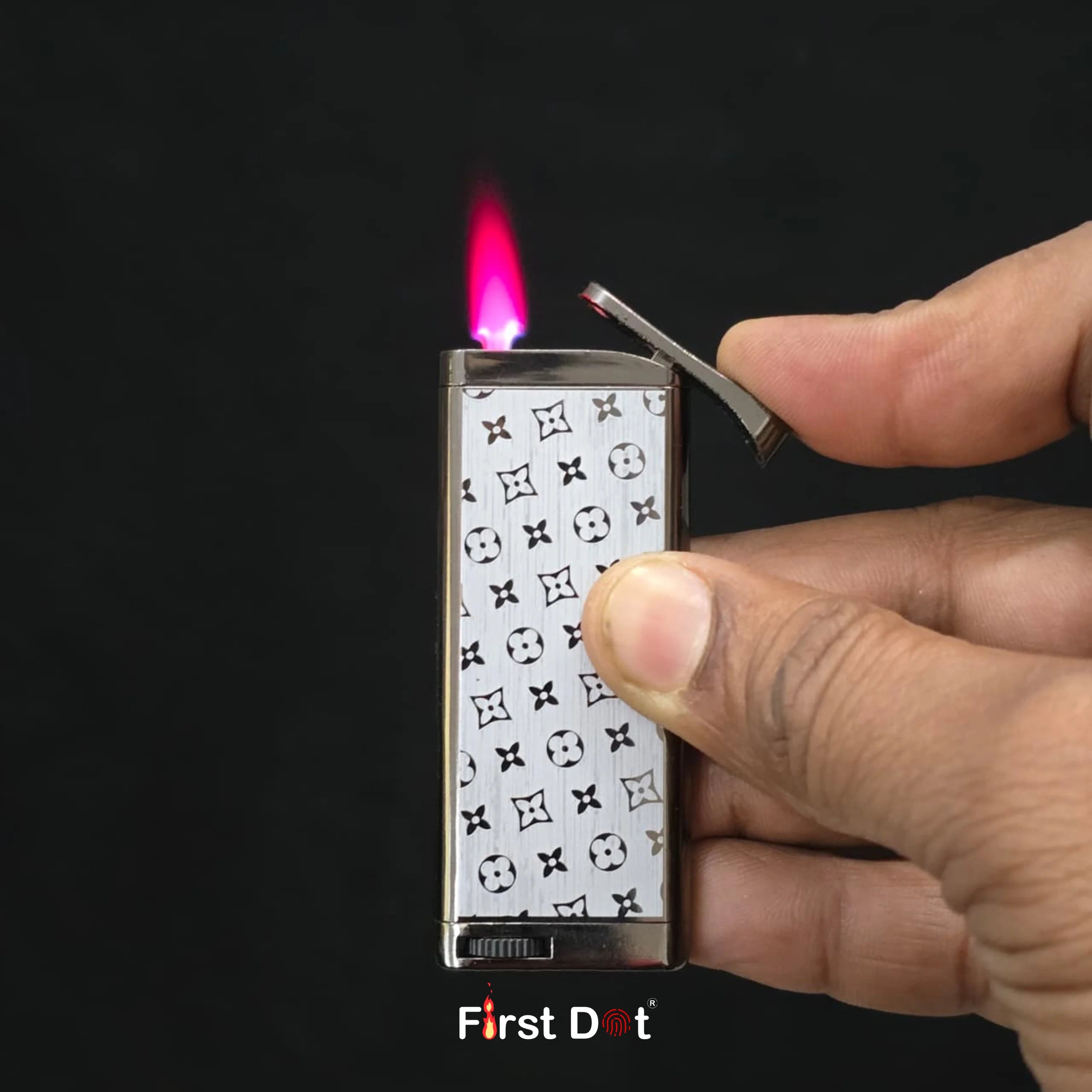 Hand holding a lighter with a visible brand logo against a dark background