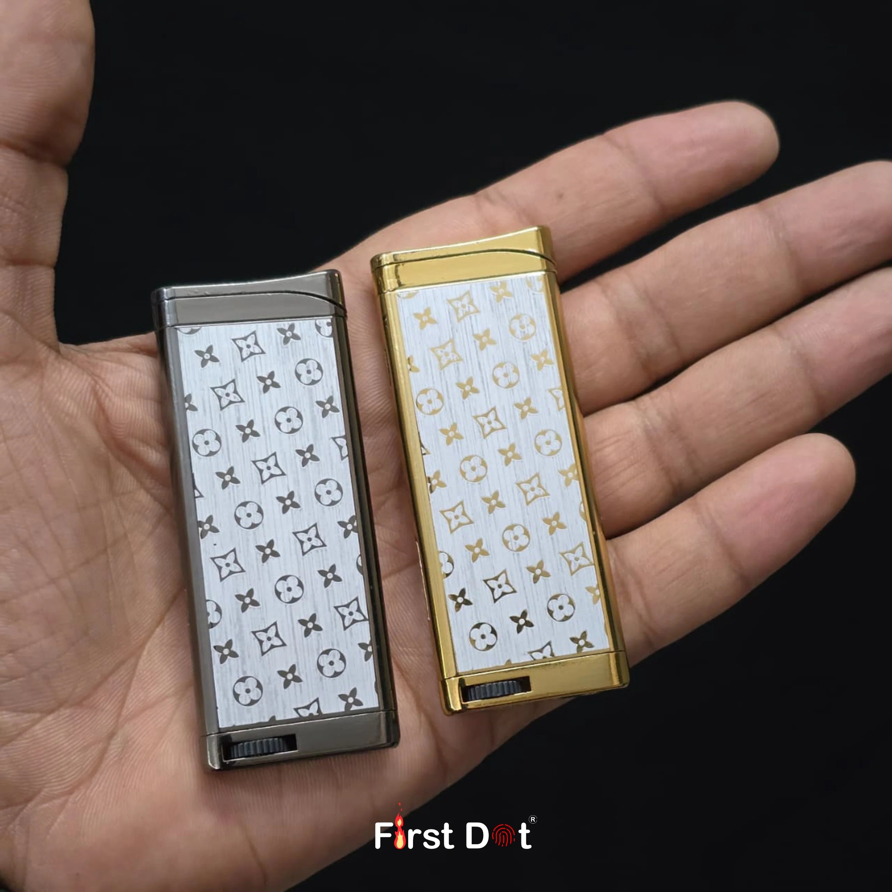 Two lighters with patterned covers held in a hand, brand 'First Dot' visible.
