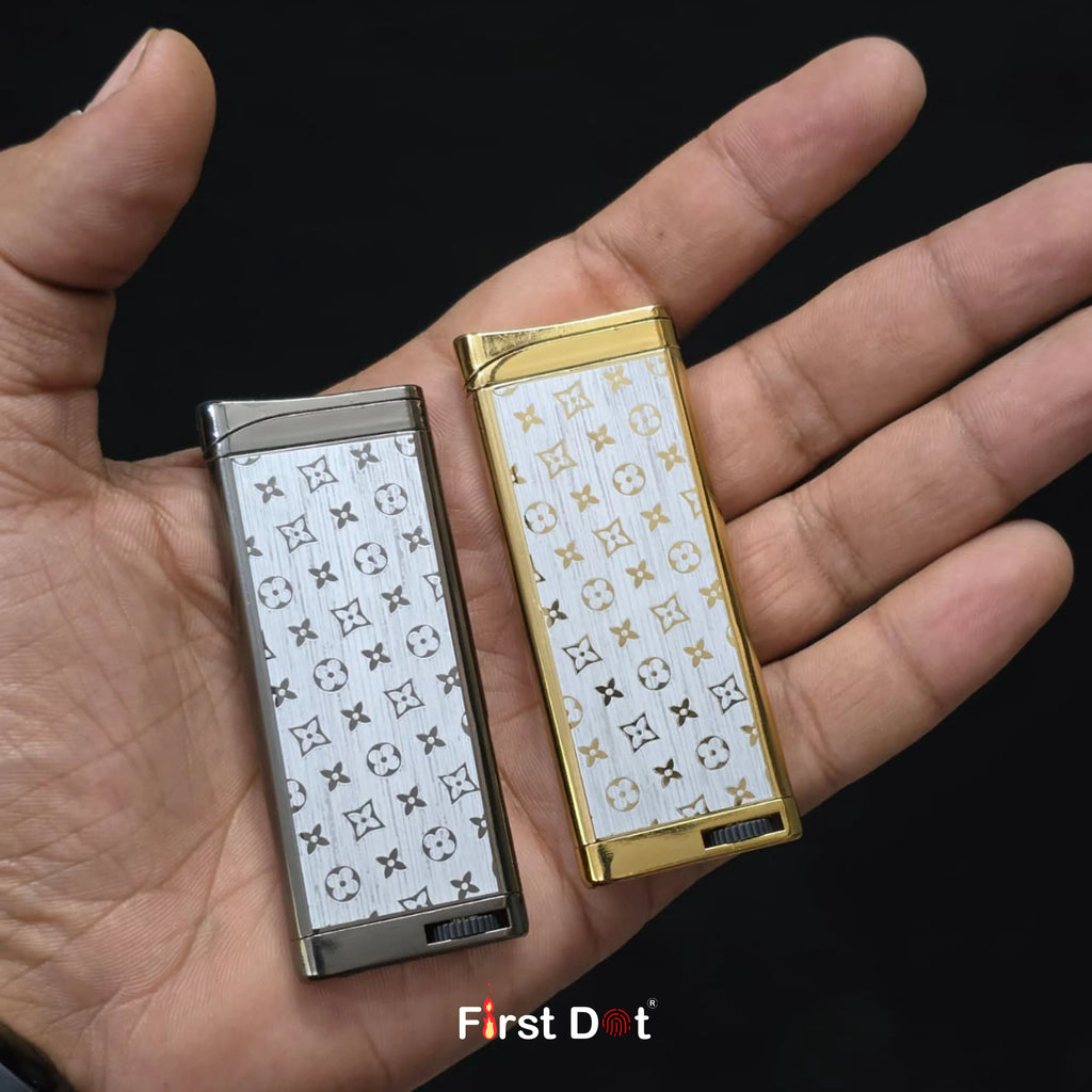 Two patterned lighters held in a hand with 'First Dot' branding.