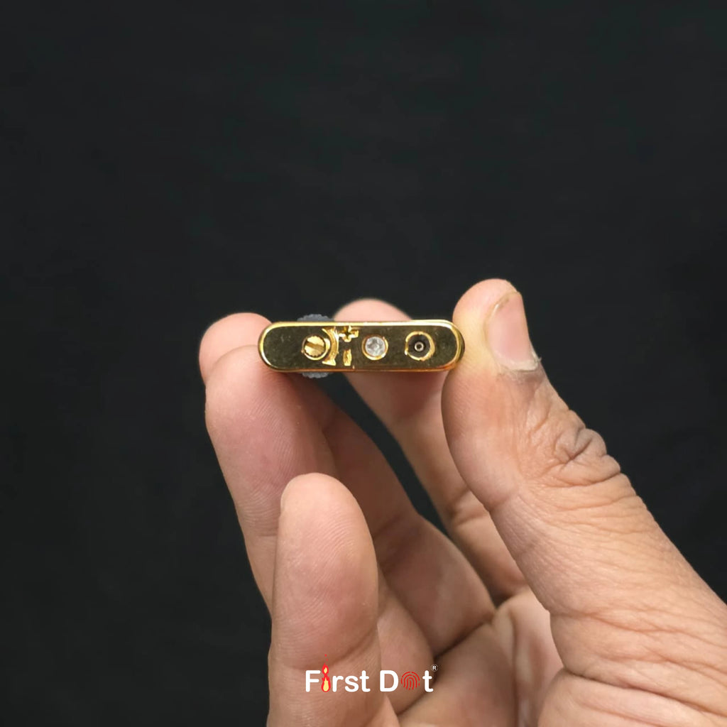 Small electronic device held in a hand with a black background