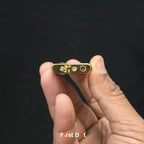Small electronic device held in a hand with a black background