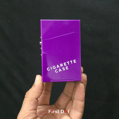 Purple cigarette case held in a hand against a black background