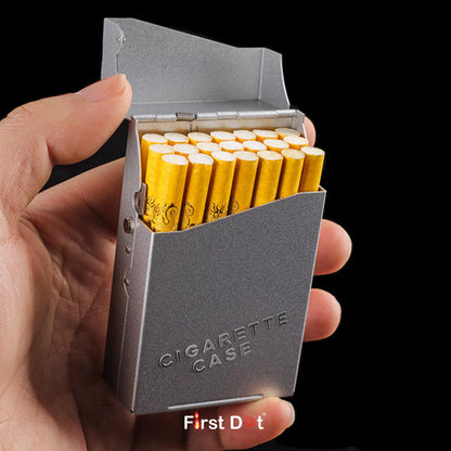 Hand holding a gray cigarette case with yellow cigarettes on a black background