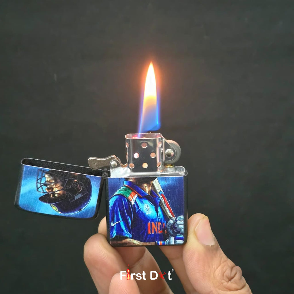Lighter with a colorful design held by a hand against a dark background