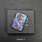 Pin with a sports player design on a black box labeled 'First Dot' on a textured dark surface.