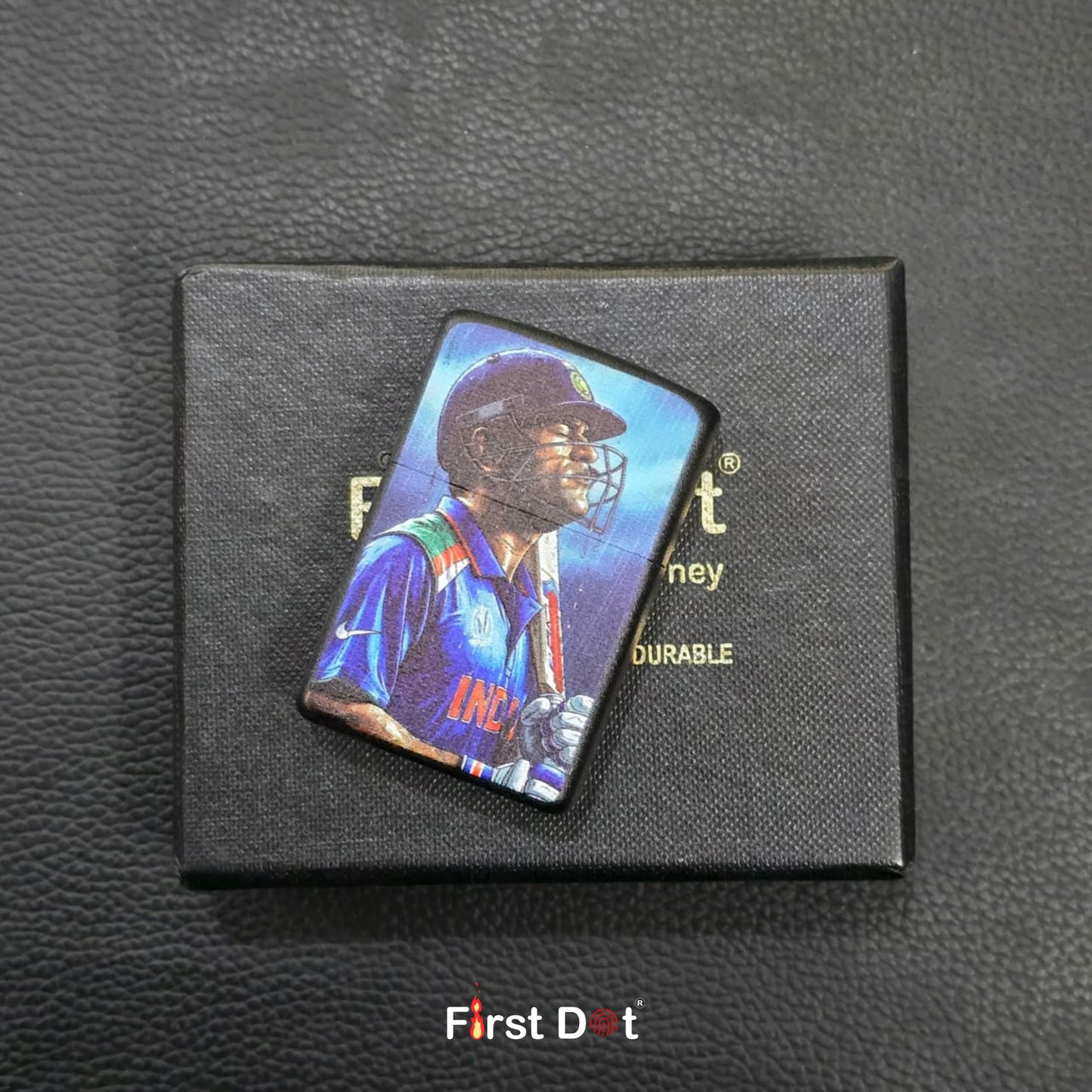 Pin with a sports player design on a black box labeled 'First Dot' on a textured dark surface.