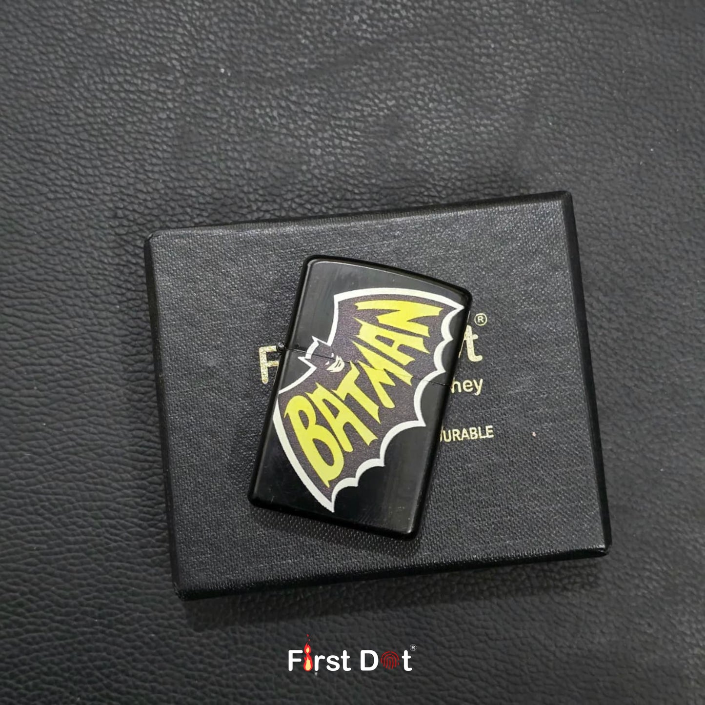 Batman logo patch on a black card with 'First Dot' branding