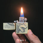 Hand holding a lighter with a wolf design and lit flame on a dark windproof cigarette lighter online in Indiabackground