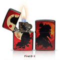 Two Zippo-style lighter cases with a red, black, and orange samurai design, shown on a white background. One lighter is open with a flame lit, and the other stands closed beside it.
