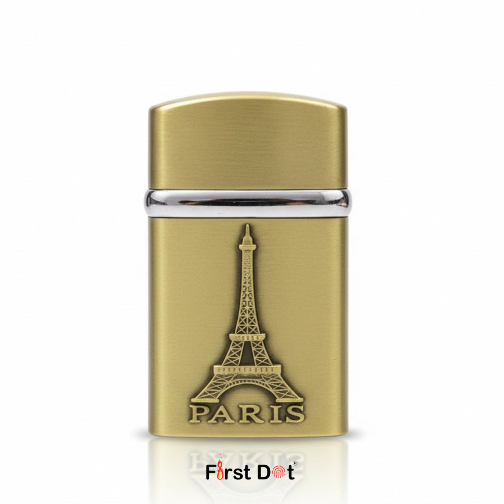 Gold lighter with Eiffel Tower design on a white background