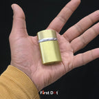 Gold cylindrical lighter held in a hand with 'First Dot' branding.