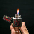 Hand holding a Zippo lighter with 'Rock' design and flame on a black background