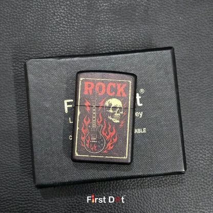Lighter with 'Rock' design on a black leather surface, branded 'First Dot'.
