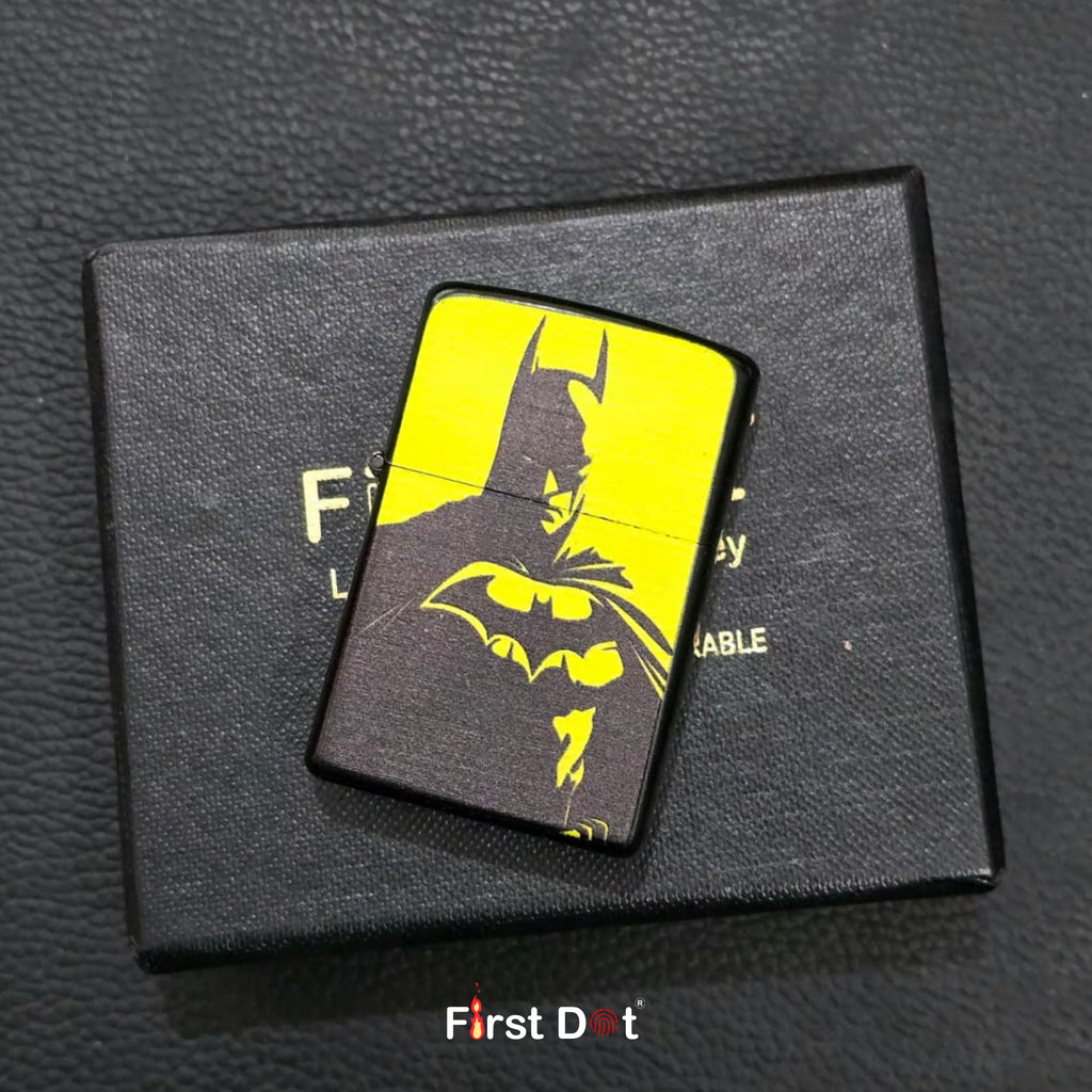 Batman-themed lighter on a black box with 'First Dot' branding.