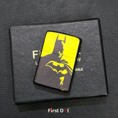 Batman-themed lighter on a black box with 'First Dot' branding.