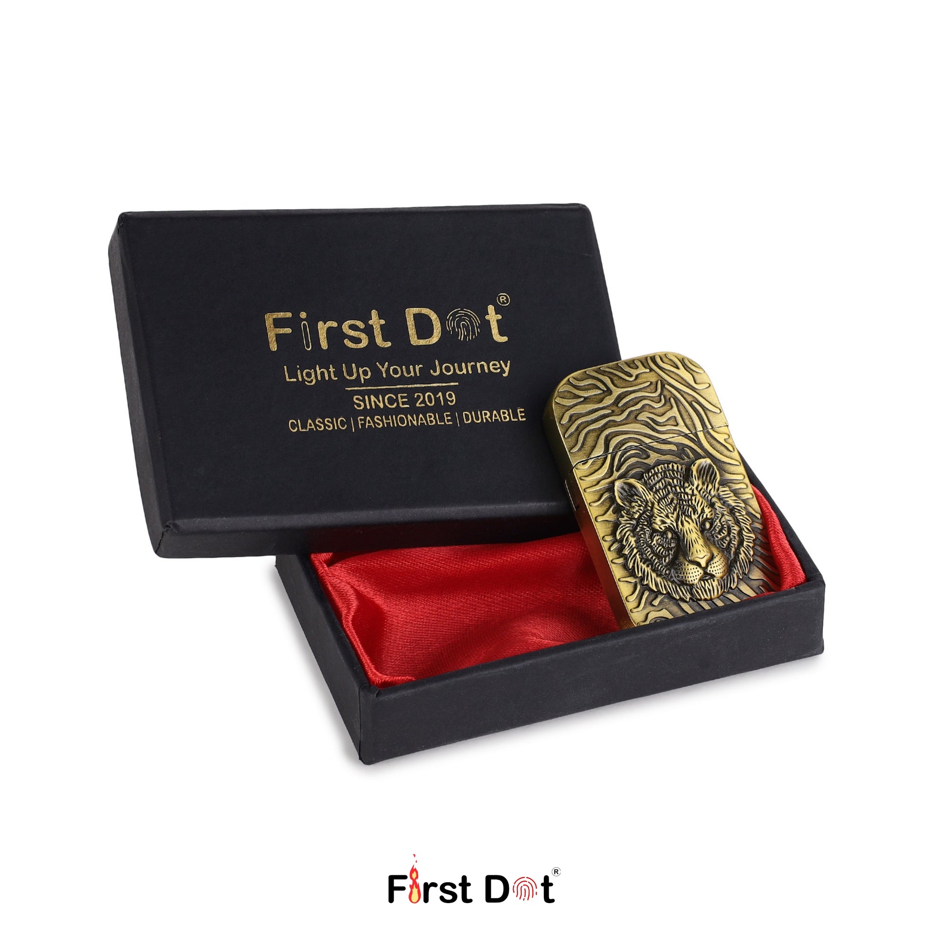 Gold tiger head lighter in a black box with red interior, branded 'First Dot'.