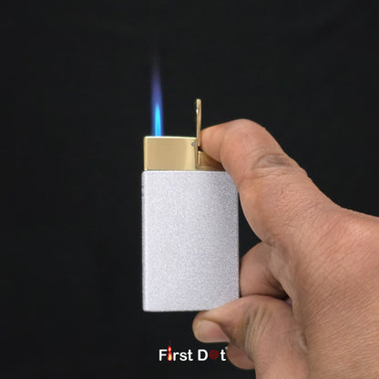 Hand holding a lighter with a flame against a black background, featuring 'First Dot' branding.