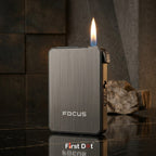 Focus lighter with flame on a reflective surface