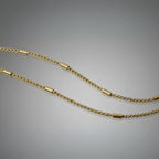 Gold chain necklace on a gray background First Dot Golden Ball Beaded Chain for Men 