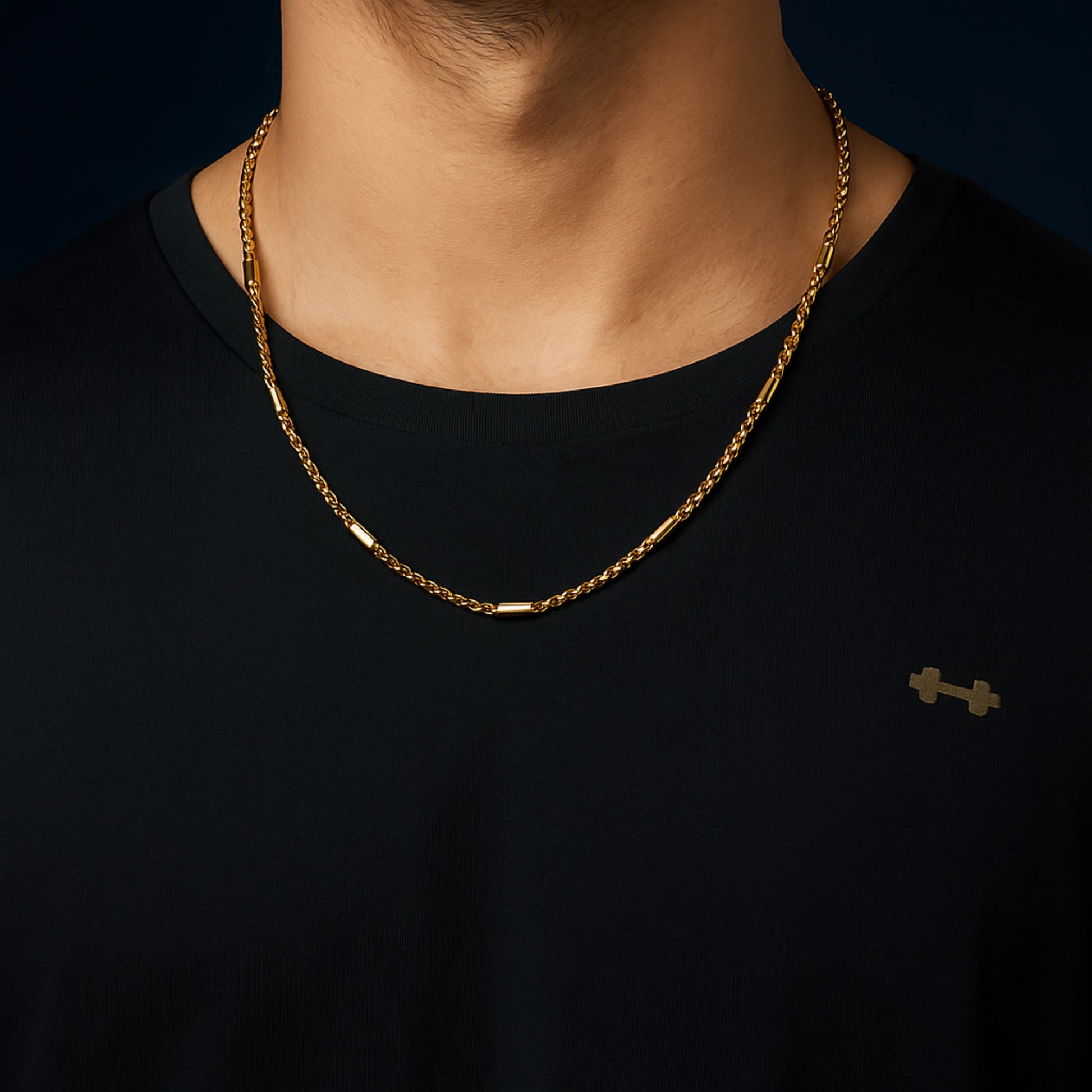 Gold chain necklace on a black shirt against a dark background First Dot Golden Ball Beaded Chain for Men 