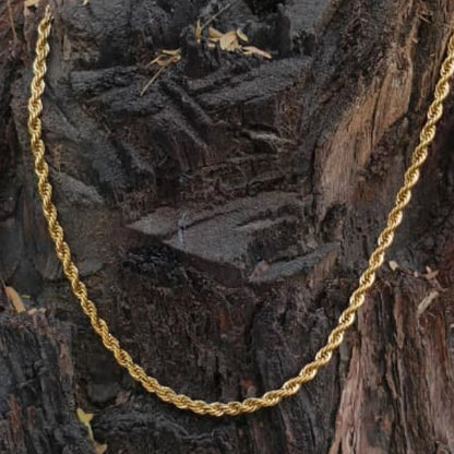 Gold rope chain necklace on a wooden background Golden Rope Chain for Men – Classic Stylish Necklace