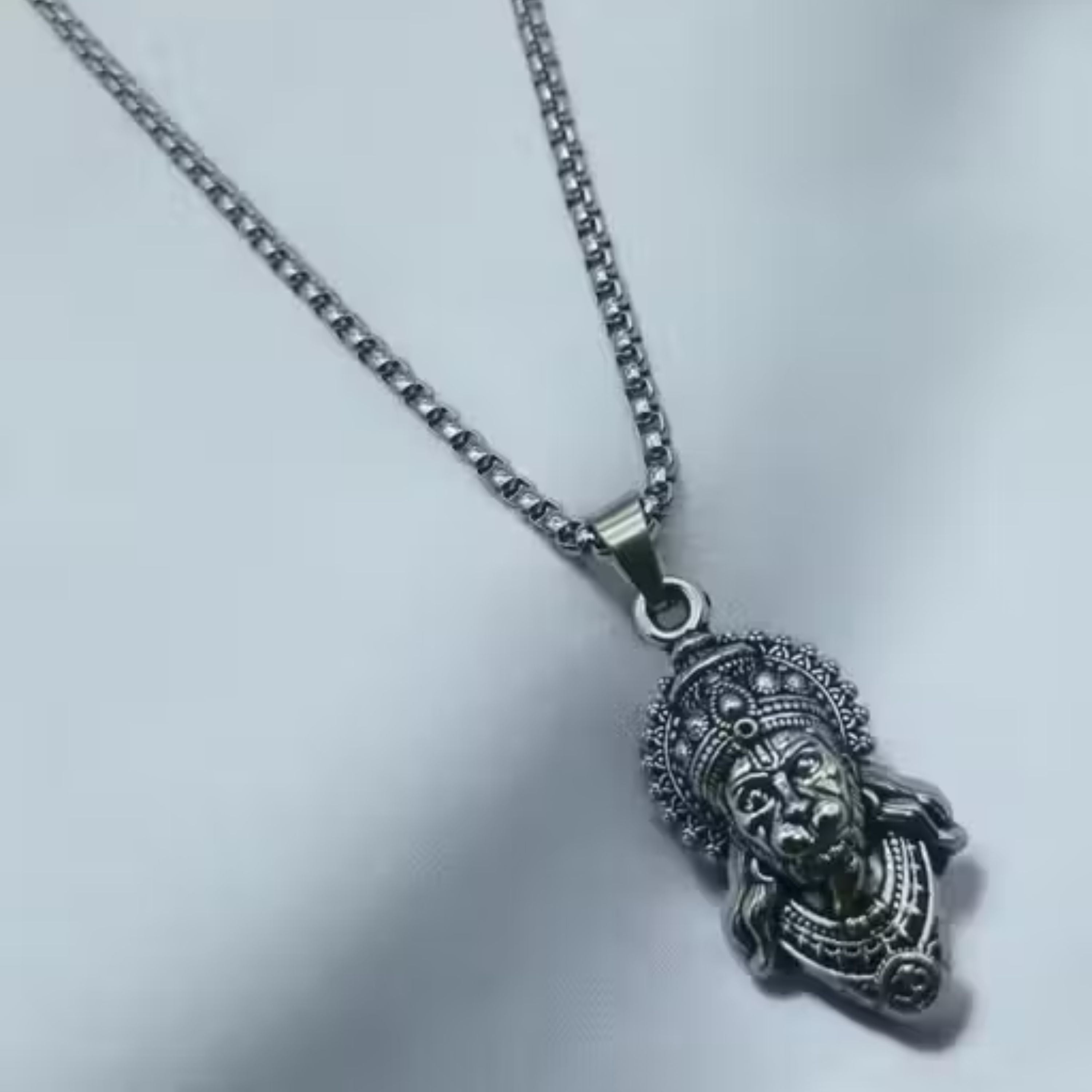 Silver pendant necklace on a light gray background HanumanjiPendantLocketwithChain