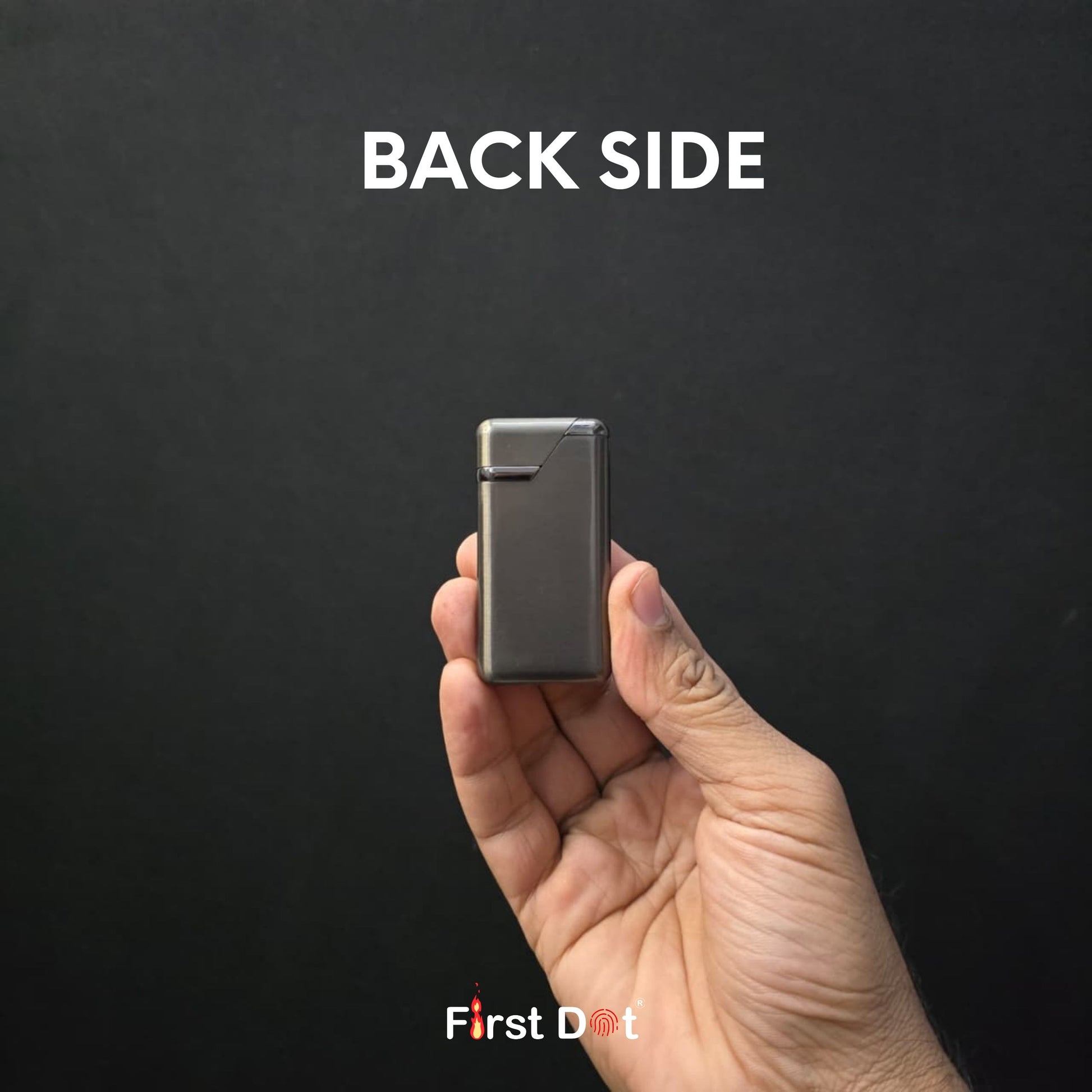Hand holding a small metallic object labeled 'Back Side' with 'First Dot' branding on a black background.