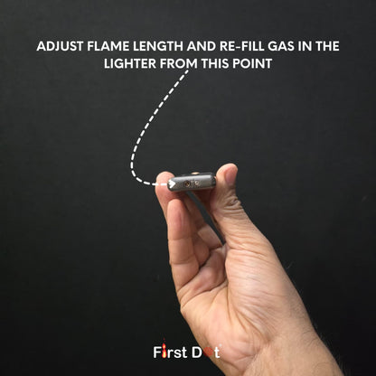 Hand holding a lighter with text on a black background, featuring the brand 'First Dot'.