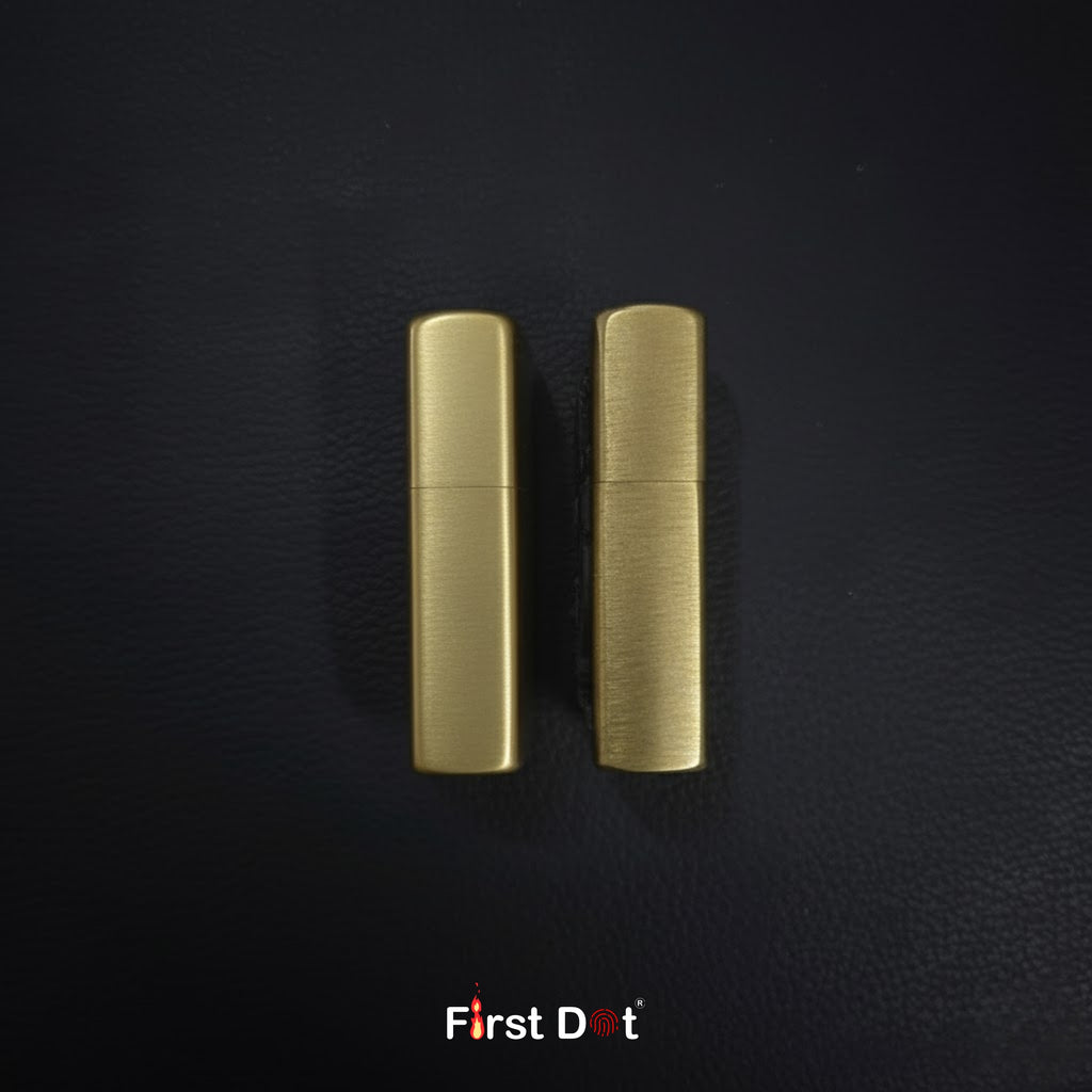 Two gold lighters on a black textured background with 'First Dot' branding.