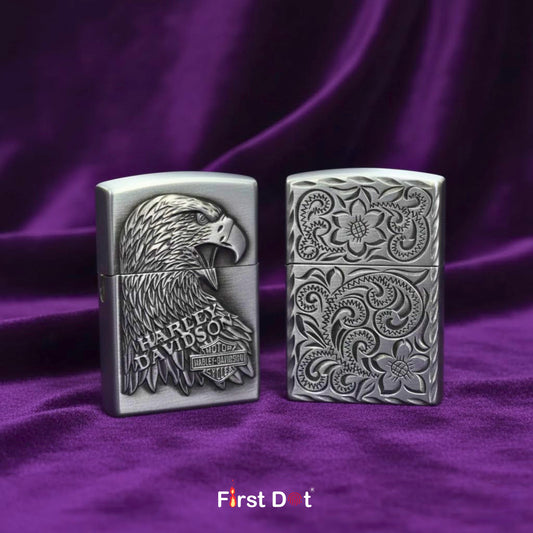Two Harley Davidson lighters on a purple fabric background with 'First Dot' branding.