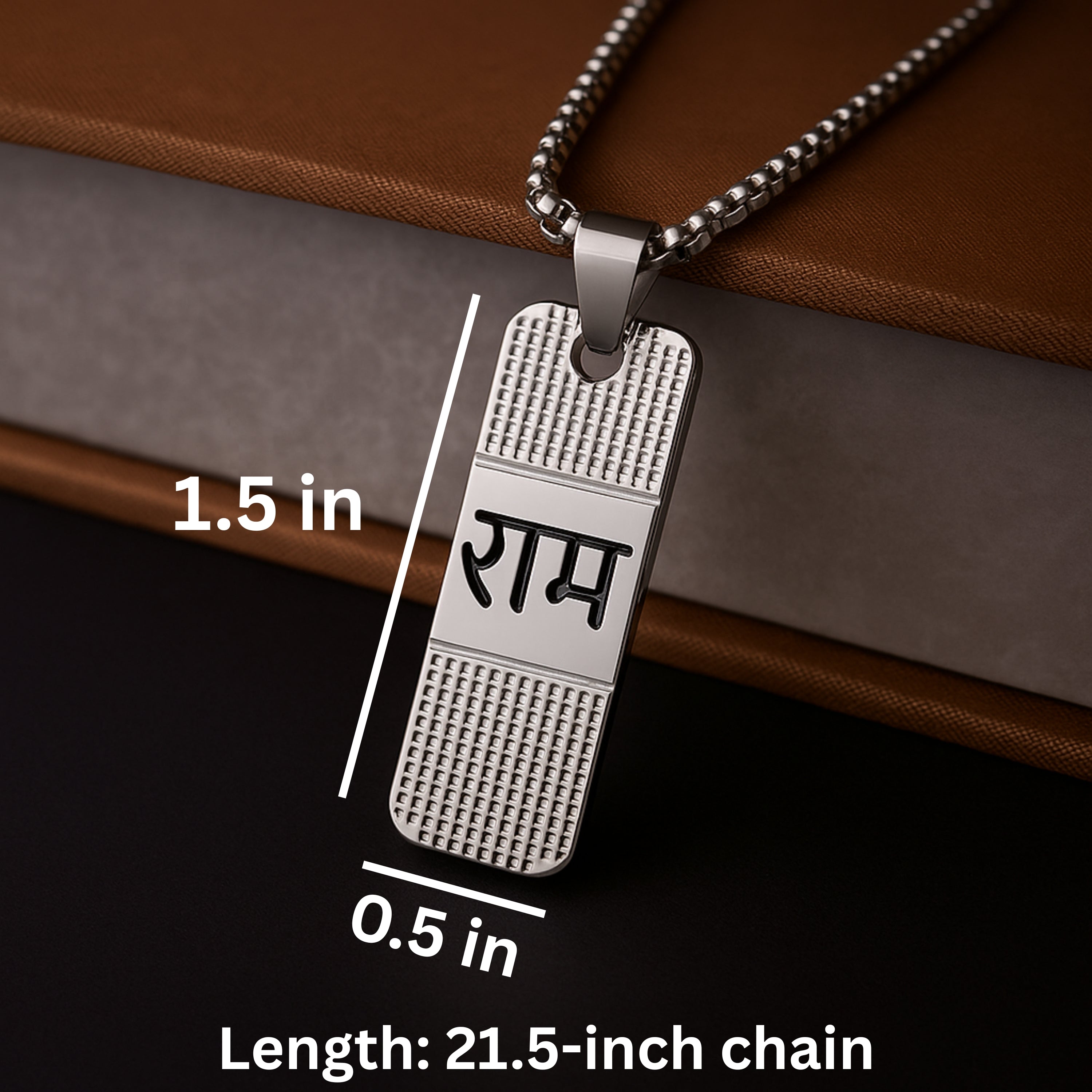Silver pendant with text on a brown surface, showing measurements and chain length. Silver necklace with a pendant on a wooden surface ShriRam NaamPendantLocketwithChain