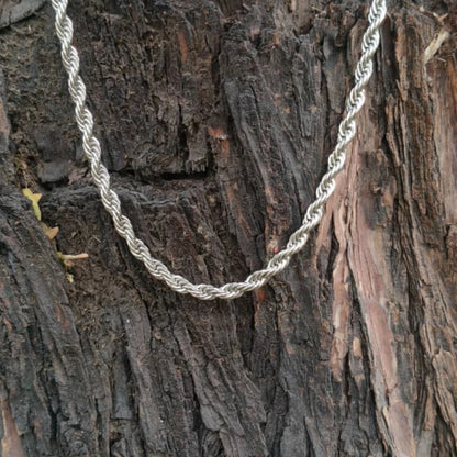 Silver rope chain on a textured wooden surface First dot Silver Rope Chain for Men – Classic Stylish Necklace