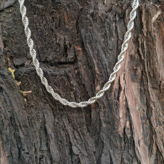 Silver rope chain on a textured wooden surface First dot Silver Rope Chain for Men – Classic Stylish Necklace