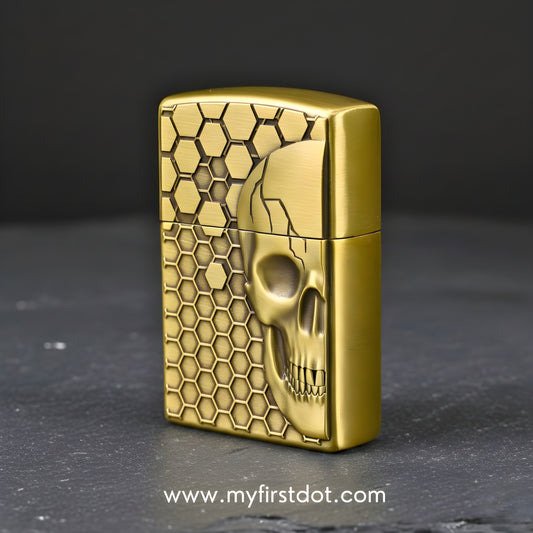 Gold skull design lighter with honeycomb pattern on a dark  background